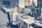 Business woman sitting in office. Woman having pause in work.