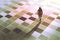 Business woman standing on the floor with graphic pattern tiles