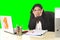 Business woman suffering stress working at office isolated green chroma key background