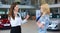 Business woman trying to calm down dissatisfied customer woman