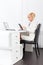 Business woman using tablet bright ofice desk