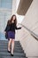 Business woman walking in hurry on stairs