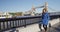 Business Woman Walking By River Thames and London Tower Bridge In England