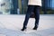 A business woman walks to the business center in heels.