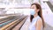 Business woman wearing face mask at train station