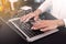 Business woman working in the office using a laptop with email icons on a virtual screen, sending email, direct marketing, online