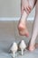 Business women back heel got scratched and hurt after wearing uncomfortable heel