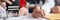 Business women signing document and certifying seal closeup