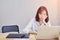 Business women sit and strain the computer screen for a long time. Because the work has been overloaded.