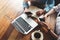 Business women teamwork with laptop, mobile phone in coffee shop