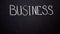 Business written on blackboard, startup development, motivation and inspiration