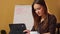 Business young woman reads financial news in computer device