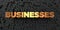 Businesses - Gold text on black background - 3D rendered royalty free stock picture