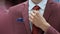 Businessman Adjust Necktie his Suit in the suit shop