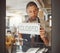 Businessman advertising that his shop is closed. Young business owner closing his restaurant. Shop owner hanging a