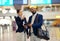 Businessman, airport and passenger assistant pointing traveler to departure, flight time or information. Black male with