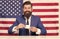 Businessman with American flag and coffee. politician drink coffee. Bearded businessman patriotic for usa. happy