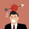 Businessman with apple and arrow on his head