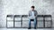 Businessman applicant using laptop sit on chair in waiting room