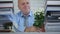 Businessman Arrange a Flower on Desk In Office Room