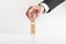 Businessman arranging wooden blocks with human icons