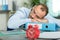 businessman asleep on folder on office desk