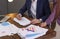 Businessman and assistant working with documents at table