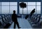 Businessman with baggage silhouette in airport