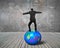 Businessman balancing on the colorful symbols ball