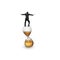 Businessman balancing on hourglass