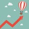 Businessman on balloon pull arrow graph up