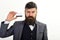 Businessman with beard holds credit card. Banker trust in safety and reliability of banking system. Banking concept. Man