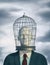 Businessman with a bird cage head