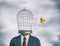 Businessman with a bird cage head and a canary flying off