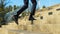 Businessman in black classic shoes and trousers runs going up the stairs. Legs of a businessman in fashionable shoes walking