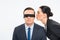 Businessman in blindfold and businesswoman