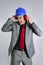 Businessman blue hardhat and safety headphones