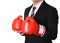 Businessman with boxing gloves isolated