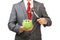 Businessman breaking green piggy bank