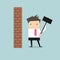 Businessman breaking wall with hammer