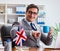 Businessman with British flag in the office