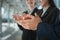 Businessman and business woman clap their hands to congratulate the signing of an agreement or contract between their companies