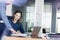 Businessman and businesswoman discussing over documents at desk in office