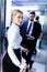 businessman and businesswoman entering elevator