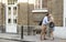 Businessman And Businesswoman Greeting Each Other On Street