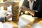 Businessman and Businesswoman group plan and play jenga wooden b