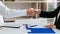 Businessman and businesswoman handshaking over the office desk after Greeting new colleague, business meetings concept