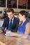 Businessman And Businesswoman Meeting In Coffee Shop