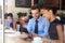 Businessman And Businesswoman Meeting In Coffee Shop