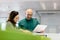 Businessman and businesswoman with paperwork in office